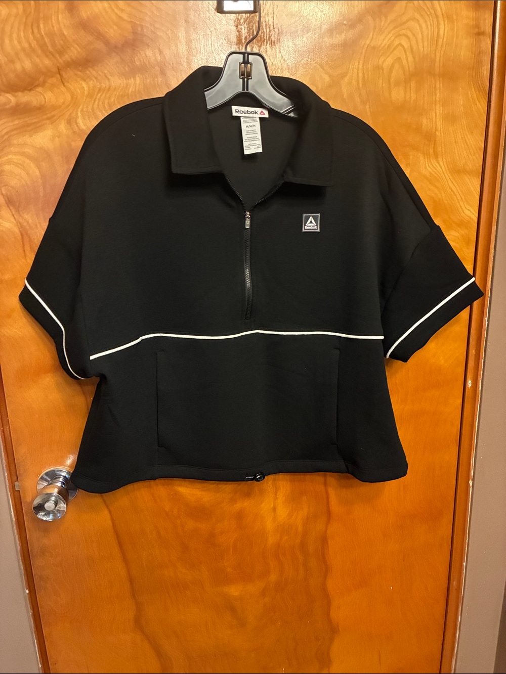 REEBOK. Black Short-Sleeve Half-Zip Sweatshirt with White Piping. Size M. NWT